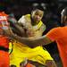 Michigan sophomore Trey Burke attempts to pass the ball through Syracuse defenders during the second half of the Final Four in Atlanta on Saturday, April 6, 2013. Melanie Maxwell I AnnArbor.com